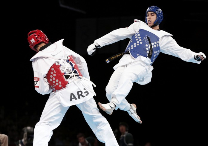 Spain's Nicolas Garcia Hemme fights against Argentina's Sebastian Eduardo Crismanich during their men's -80kg gold medal taekwondo match at the London Olympic Games at the ExCeL venue